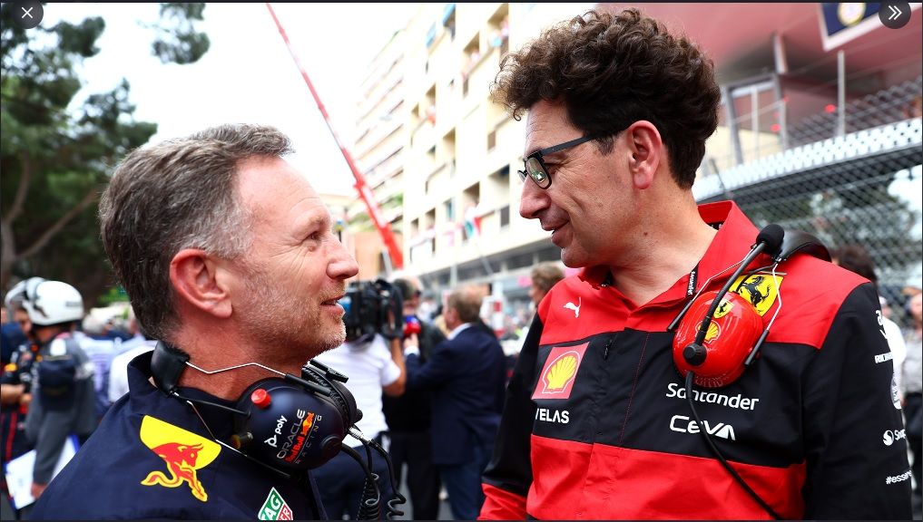 Prinsipal Tim Red Bull Racing Christian Horner berbincang bersama Mattia Binotto dari Ferrari.