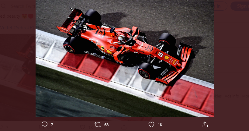 Sebastian Vettel melesat di atas mobil Tim Scuderia Ferrari dalam sebuah lomba F1 musim lalu.