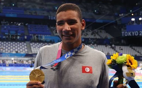 Perenang Tunisia, Ahmed Hafnaoui, membuat kejutan dengan meraih medali emas Olimpiade Tokyo 2020 di usia 18 tahun.