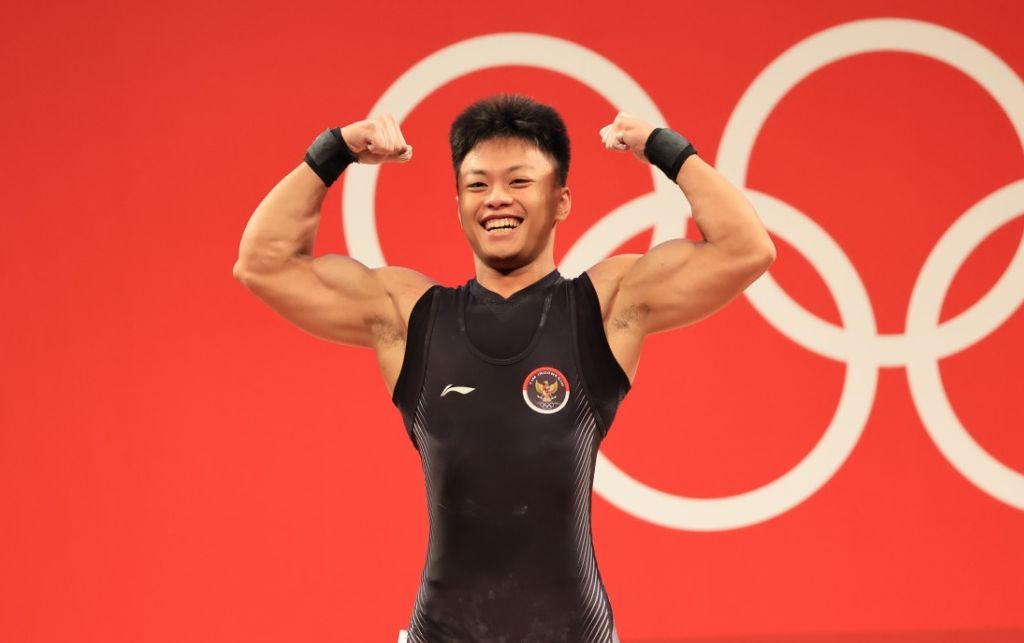 Rahmat Erwin Abdullah, lifter Indonesia di kelas 73 kg putra. Dia menjadi yang terbaik di Grup B Olimpiade Tokyo 2020, Rabu (28/7/2021). 